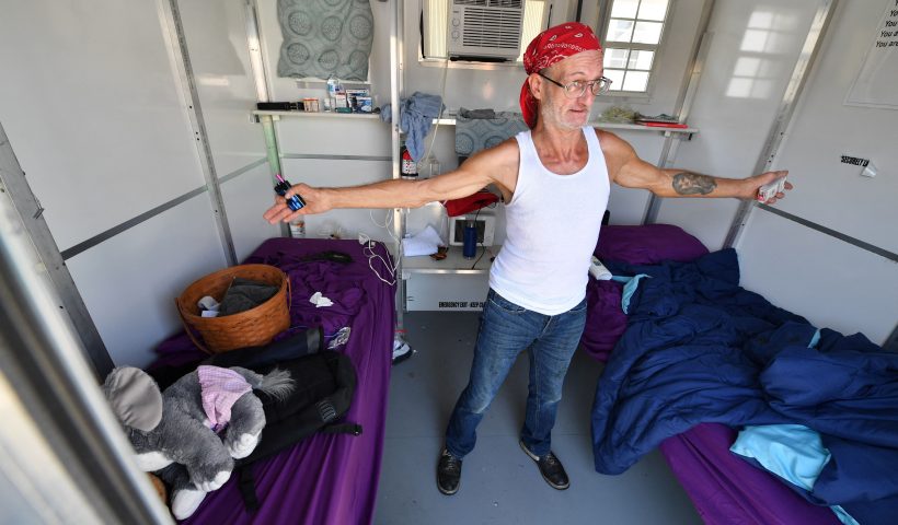 Jerome Bestul, age 62 from Wisconsin, expresses his pleasure at having a safe place to sleep and live at the Tarzana Tiny Home Village which offers temporary housing for people experiencing homelessness, on July 9, 2021 in the Tarzana neighborhood of Los Angeles, California. - The habitats are very small prefabricated houses, installed in a parking lot in Los Angeles. The "tiny homes" are multiplying in the city in an attempt to offer homeless people a transition from the street to permanent housing. The question arises particularly in the California metropolis, which hosts Hollywood, its stars and its glitter but also the camps of tens of thousands of homeless people, whose tents are visible throughout the city. (Photo by Robyn Beck / AFP) (Photo by ROBYN BECK/AFP via Getty Images)