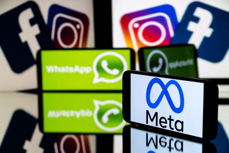This picture taken on January 12, 2023 in Toulouse, southwestern France shows a smartphone and a computer screen displaying the logos of the Instagram, Facebook, WhatsApp and their parent company Meta. (Photo by Lionel BONAVENTURE / AFP) (Photo by LIONEL BONAVENTURE/AFP via Getty Images)