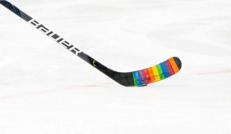 VANCOUVER, BC - MARCH 22: The Vancouver Canucks tape their sticks with rainbow tape for the pre-game warm up to celebrate 