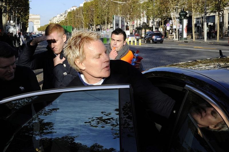 US Mike Jeffries, CEO of US clothing retailer Abercrombie & Fitch leaves the store on the Champs Elysees avenue in Paris on October 27, 2012, as some workers protest against their working conditions. They declared the management did not respect French social rules. AFP PHOTO BERTRAND GUAY (Photo credit should read BERTRAND GUAY/AFP via Getty Images)
