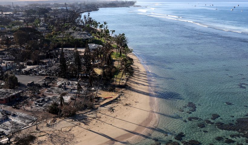 LAHAINA, HAWAII - AUGUST 11: In an aerial view, homes and businesses are seen that were destroyed by a wildfire on August 11, 2023 in Lahaina, Hawaii. Dozens of people were killed and thousands were displaced after a wind-driven wildfire devastated the town of Lahaina on Tuesday. Crews are continuing to search for missing people. (Photo by Justin Sullivan/Getty Images)