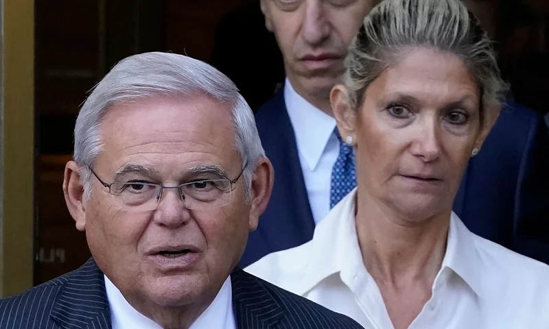 US-POLITICS-JUSTICE-MENENDEZ US Senator Bob Menendez (L), Democrat of New Jersey, with his wife Nadine Arslanian (R), leaves US District Court, Southern District of New York, in New York City on September 27, 2023, after their arraignment. Menendez and Arslanian pleaded not guilty to bribery charges. (Photo by TIMOTHY A. CLARY / AFP) (Photo by TIMOTHY A. CLARY/AFP via Getty Images)