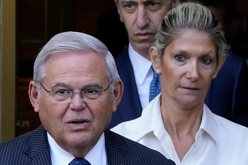 US-POLITICS-JUSTICE-MENENDEZ
US Senator Bob Menendez (L), Democrat of New Jersey, with his wife Nadine Arslanian (R), leaves US District Court, Southern District of New York, in New York City on September 27, 2023, after their arraignment. Menendez and Arslanian pleaded not guilty to bribery charges. (Photo by TIMOTHY A. CLARY / AFP) (Photo by TIMOTHY A. CLARY/AFP via Getty Images)