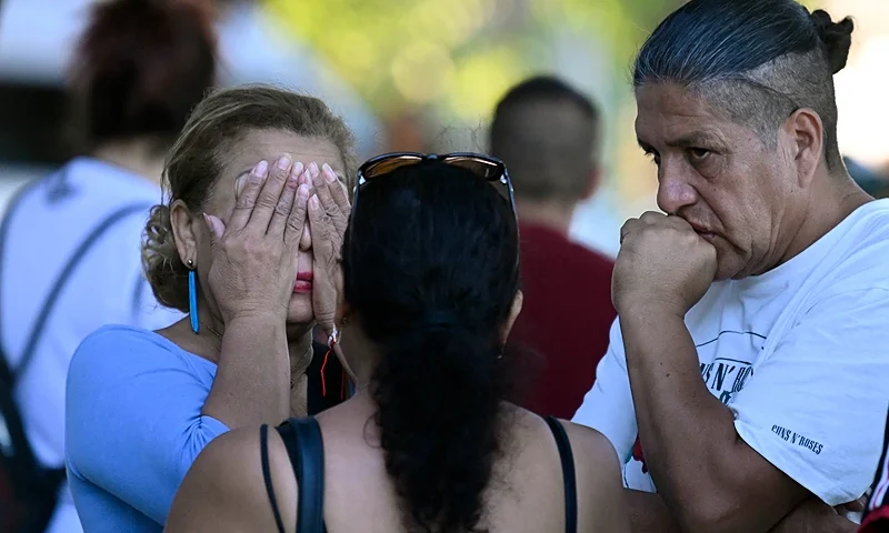 The mother of one of the victims, killed in a fire at a nightclub where he was celebrating his birthday in Murcia, reacts outside the city's Sports Pavillion where they have received psychological assistance, on October 1, 2023. At least 13 people were killed in a fire in a Spanish nightclub today morning, authorities said, with fears the toll could still rise as rescue workers sift through the debris. The fire appears to have broken out in a building housing the "Teatre" and "Fonda Milagros" clubs in the city of Murcia in southeastern Spain in the early morning hours. (Photo by JOSE JORDAN / AFP) (Photo by JOSE JORDAN/AFP via Getty Images)