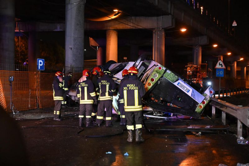 TOPSHOT - Firefighters work on the site of a bus accident on October 03, 2023 in Mestre, near Venice. At least 20 people were killed Tuesday when a bus plunged off a bridge in the northern Italian city of Venice, a city hall spokesman told AFP. The crash caused 