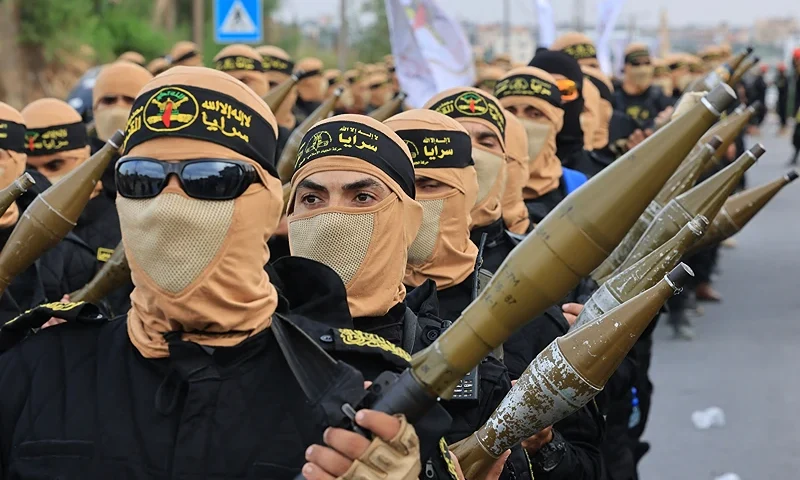 Palestinian militants of the Islamic Jihad movement participate in an anti-Israel military parade marking the 36th anniversary of the movement's foundation in Gaza City, October 4, 2023. (Photo by MAHMUD HAMS/AFP via Getty Images)