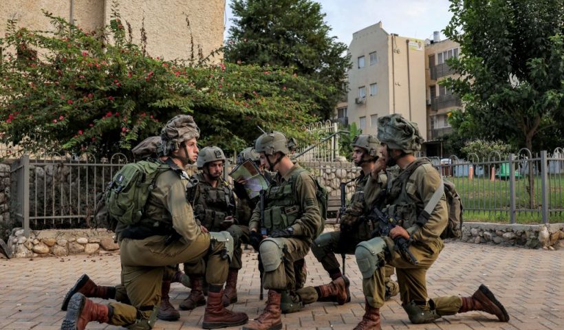 Israeli army soldiers deploy in the southern city of Sderot on October 8, 2023. The death toll surged to almost 1,000 since Palestinian militant group Hamas launched its massive surprise attack on Israel with a barrage of rockets and a massive ground assault, officials on both sides said on October 8. (Photo by Menahem KAHANA / AFP) (Photo by MENAHEM KAHANA/AFP via Getty Images)
