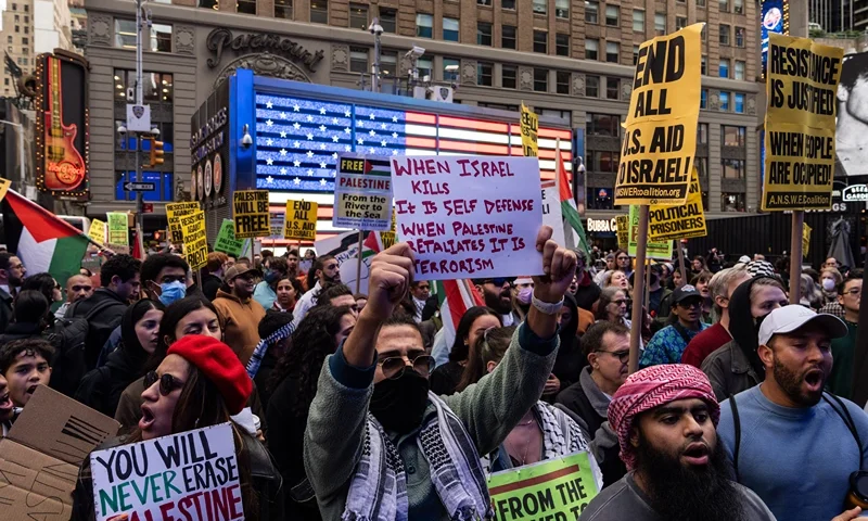 NEW YORK, NEW YORK - OCTOBER 8: Demonstrators march in support of the Palestinian people on October 8, 2023 in Times Square in New York City. (Photo by Adam Gray/Getty Images)