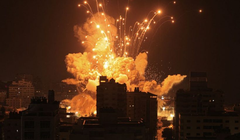 TOPSHOT - A missile explodes in Gaza City during an Israeli air strike on October 8, 2023. srael, reeling from the deadliest attack on its territory in half a century, formally declared war on Hamas Sunday as the conflict's death toll surged close to 1,000 after the Palestinian militant group launched a massive surprise assault from Gaza. (Photo by MAHMUD HAMS / AFP) (Photo by MAHMUD HAMS/AFP via Getty Images)
