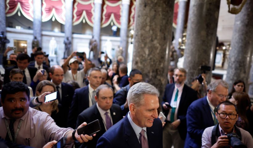 WASHINGTON, DC - OCTOBER 03: Speaker of the House Kevin McCarthy (R-CA) is surrounded by staff, security and journalists as he walks to the House Chamber ahead of a vote at the U.S. Capitol on October 03, 2023 in Washington, DC. McCarthy's speakership is being challenged by a handful of conservative members of his own party lead by Rep. Matt Gaetz (R-FL) following a deal to keep the federal government from partially shutting down over the weekend. (Photo by Chip Somodevilla/Getty Images)