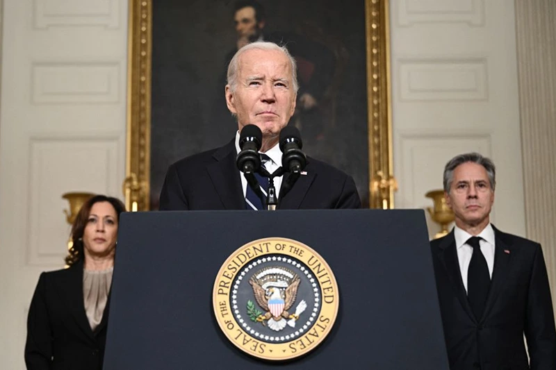 US President Joe Biden speaks about the Palestinian militant group Hamas' attacks on Israel as Vice President Kamala Harris and Secretary of State Antony Blinken look on in the State Dining Room of the White Houses in Washington, DC, on October 10, 2023. The United States has no plan to become militarily involved in the conflict between Israel and Hamas after the Palestinian militant group's surprise attack, the White House said on October 9, 2023. (Photo by Brendan SMIALOWSKI / AFP) (Photo by BRENDAN SMIALOWSKI/AFP via Getty Images)
