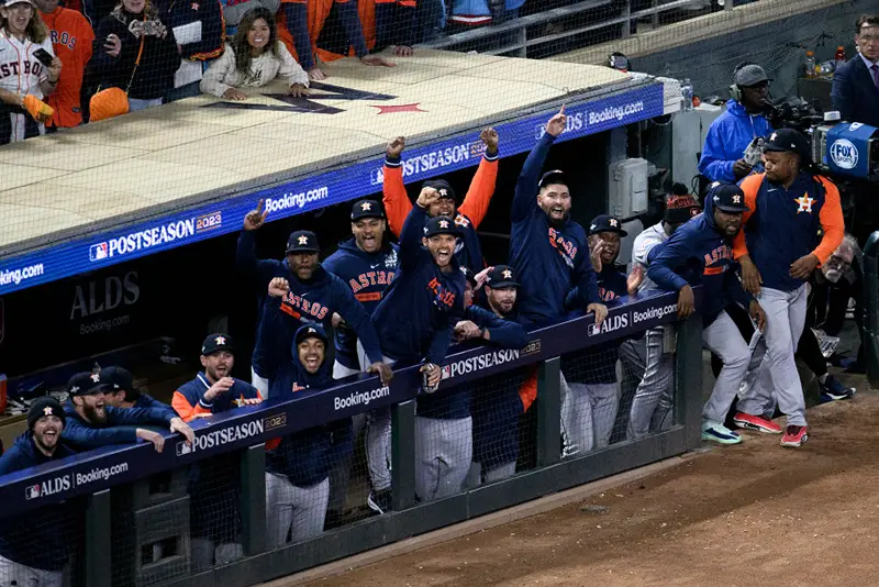 Members of the Houston Astros celebrate in the dugout after winning Game Four of the Division Series against the Minnesota Twins at Target Field on October 11, 2023 in Minneapolis, Minnesota. (Photo by Stephen Maturen/Getty Images)