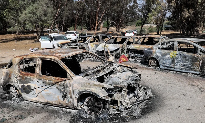 Torched vehicles are pictured at the site of the October 7 attack on the Supernova desert music Festival by Palestinian militants near Kibbutz Reim in the Negev desert in southern Israel on October 13, 2023. The rave event had drawn thousands of party-goers from October 6 to the desert site close to Kibbutz Reim, less than five kilometres (three miles) from the Gaza Strip. But it turned into a horror show early the next day when Hamas militants crossed the border on motorcycles, vans, speed boats or paramotors, launching their surprise offensive on Israel. (Photo by JACK GUEZ / AFP) (Photo by JACK GUEZ/AFP via Getty Images)