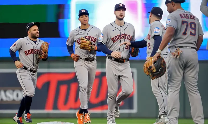 The Houston Astros celebrate after beating the Minnesota Twins 9-1 in Game Three of the Division Series at Target Field on October 10, 2023 in Minneapolis, Minnesota. (Photo by Adam Bettcher/Getty Images)