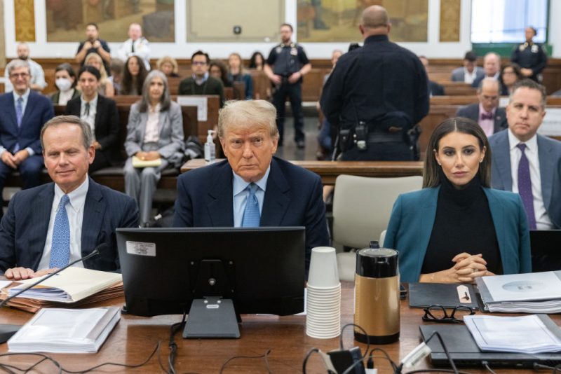 NEW YORK, NEW YORK - OCTOBER 18: Former President Donald Trump sits in the courtroom with attorneys Christopher Kise and Alina Habba during his civil fraud trial at New York State Supreme Court on October 18, 2023 in New York City. Trump may be forced to sell off his properties after Justice Arthur Engoron canceled his business certificates after ruling that he committed fraud for years while building his real estate empire after being sued by Attorney General Letitia James, who is seeking $250 million in damages. The trial will determine how much he and his companies will be penalized for the fraud. (Photo by Jeenah Moon-Pool/Getty Images)