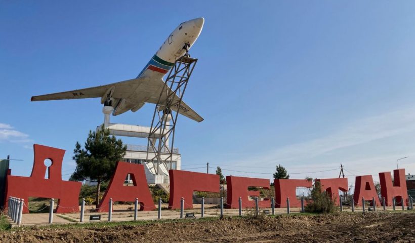 A Tupolev Tu-134B passenger plane is seen on the postament next to a sign reading as 'Dagestan' outside the airport in Makhachkala on October 30, 2023. Russian police on October 30, 2023 said they had arrested 60 people suspected of storming an airport in the Muslim-majority Caucasus republic of Dagestan, seeking to attack Jewish passengers coming from Israel. (Photo by STRINGER / AFP) (Photo by STRINGER/AFP via Getty Images)