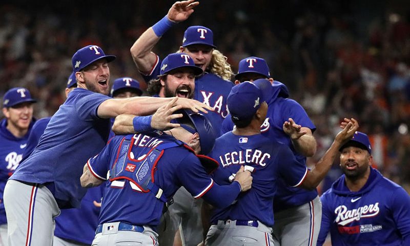 Jose Leclerc #25 of the Texas Rangers celebrates with Jonah Heim #28 after defeating the Houston Astros in Game Seven to win the American League Championship Series at Minute Maid Park on October 23, 2023 in Houston, Texas. (Photo by Bob Levey/Getty Images)