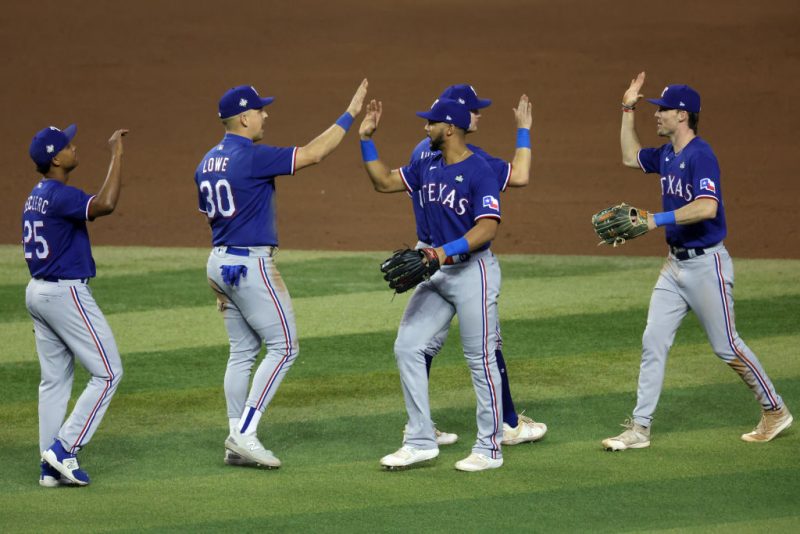 PHOENIX, ARIZONA - OCTOBER 30: The Texas Rangers celebrate after beating the Arizona Diamondbacks 3-1 in Game Three of the World Series at Chase Field on October 30, 2023 in Phoenix, Arizona. (Photo by Jamie Squire/Getty Images)