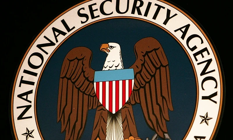 The seal of the National Security Agency (NSA) hangs at the Threat Operations Center inside the NSA in the Washington suburb of Fort Meade, Maryland, 25 January 2006. US President George W. Bush delivered a speech behind closed doors and met with employees in advance of Senate hearings on the much-criticized domestic surveillance. (Photo by Paul J. RICHARDS / AFP) (Photo by PAUL J. RICHARDS/AFP via Getty Images)