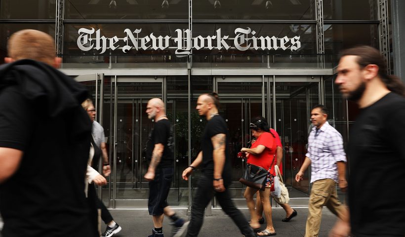 NEW YORK, NY - JULY 27: People walk past the New York Times building on July 27, 2017 in New York City. The New York Times Company shares have surged to a nine-year high after posting strong earnings on Thursday. Partly due to new digital subscriptions following the election of Donald Trump as president, the company reported a profit of $27.7 million in the second quarter, up from $9.1 million in the same period last year. (Photo by Spencer Platt/Getty Images)