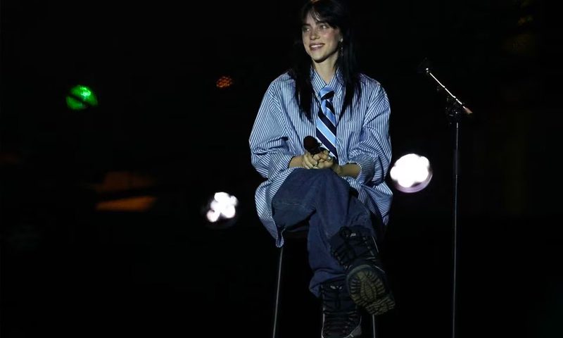 Billie Eilish smiles from the stage during the "Power Our Planet: Live in Paris" concert at the Champ de Mars on the sidelines of the Summit for a "New Global Financial Pact" in Paris, France, June 22, 2023. REUTERS/Stephanie Lecocq/File Photo