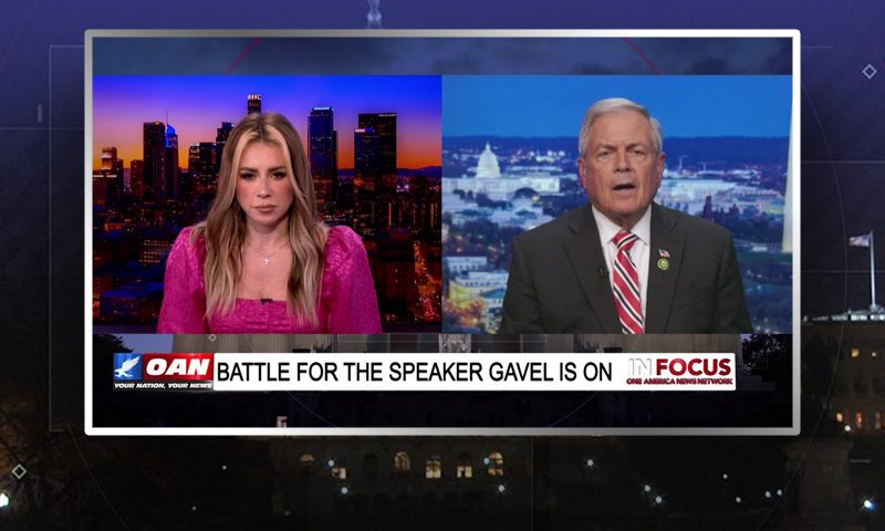 Video still from In Focus on One America News Network showing a split screen of the host on the left side, and on the right side is the guest, Ralph Norman.