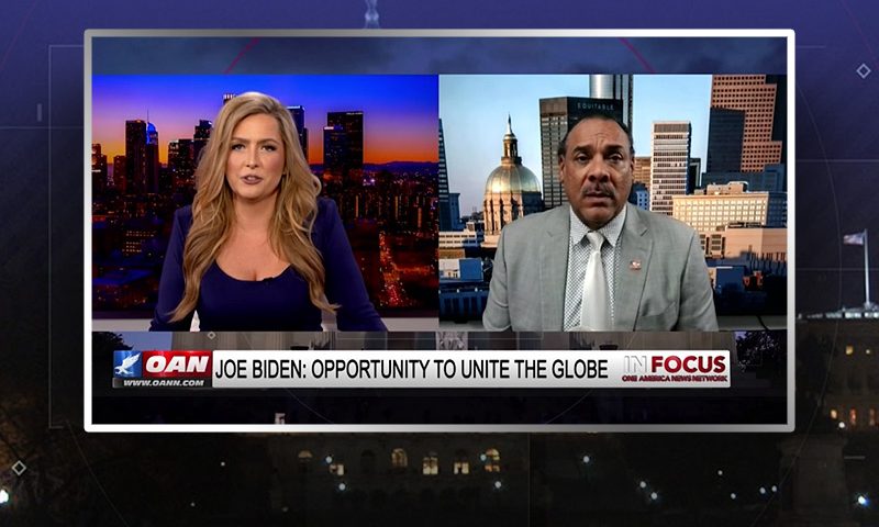 Video still from In Focus on One America News Network showing a split screen of the host on the left side, and on the right side is the guest, Bruce LeVell.