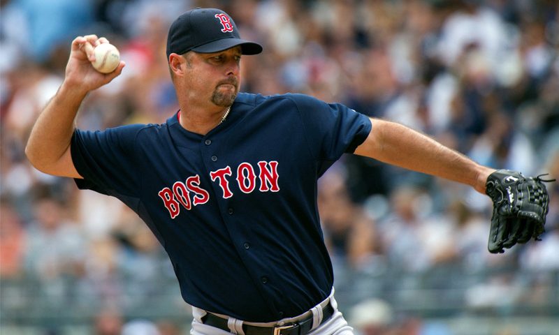Boston Red Sox starting pitcher Tim Wakefield throws a pitch to the New York Yankees in the first inning of their MLB American League baseball game at Yankee Stadium in New York September 25, 2011. REUTERS/Ray Stubblebine/File Photo