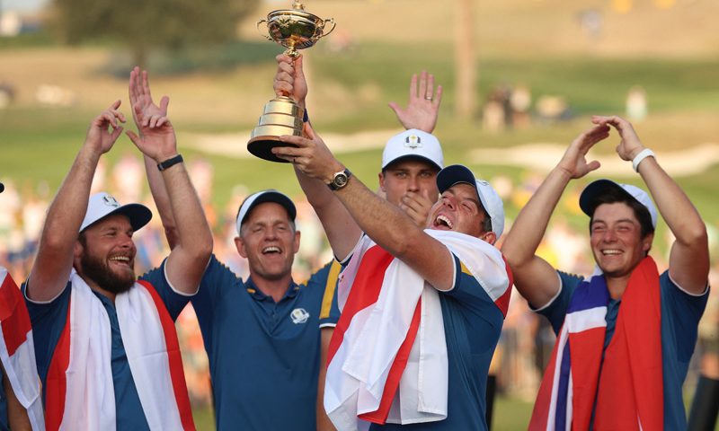 The 2023 Ryder Cup - Marco Simone Golf & Country Club, Rome, Italy - October 1, 2023 Team Europe's Rory McIlroy celebrates with the trophy and teammates during the presentation after winning the Ryder Cup REUTERS/Phil Noble