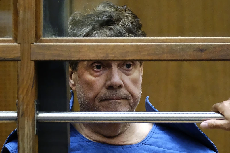 Dr. George Tyndall listens during his arraignment at Los Angeles Superior court in Los Angeles on July 1, 2019. Tyndall, the former University of Southern California gynecologist charged with sexually assaulting numerous students was found dead in his home on Wednesday, Oct. 4, 2023, according to his lawyer. (AP Photo/Richard Vogel, File)