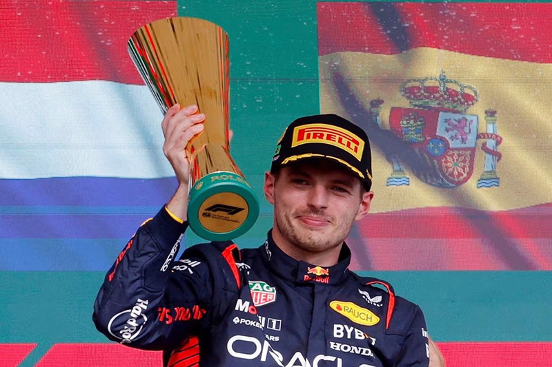 Red Bull's Max Verstappen celebrates with a trophy on the podium after winning the Formula One Brazilian Grand Prix in Sao Paulo, Brazil, November 5. REUTERS/Amanda Perobelli