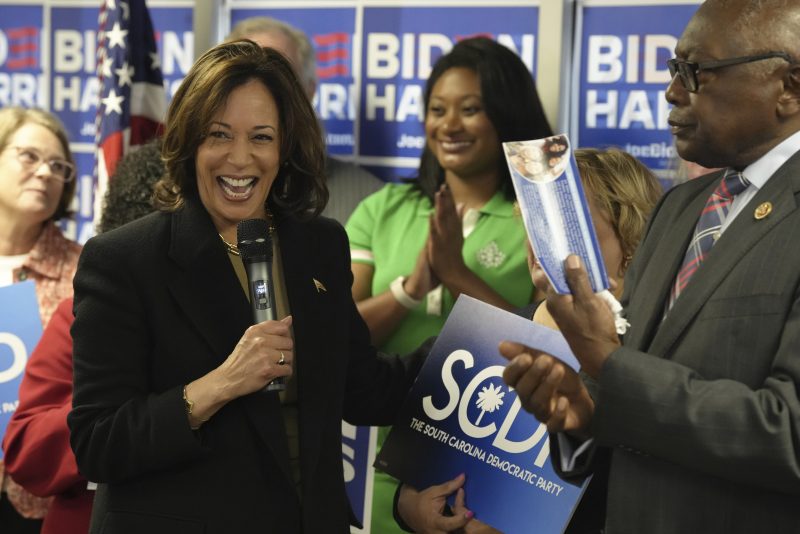 Vice President Kamala Harris, left, laughs as she stands with Rep. Jim Clyburn, D-S.C., for the official filing of President Joe Biden's paperwork to appear on South Carolina's 2024 Democratic presidential primary, on Friday, Nov. 10, 2023, in Columbia, S.C. (AP Photo/Meg Kinnard)