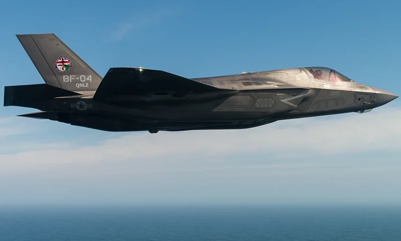 F-35B Fighter Jets Make Maiden Landings Onboard HMS Queen Elizabeth PORTSMOUTH, ENGLAND - SEPTEMBER 26: In this handout image provided by the Ministry of Defence, An F-35B fighter jet flies over HMS Queen Elizabeth on September 26, 2018 in Portsmouth, England. Two F-35B Lightning II fighter jets have successfully landed onboard HMS Queen Elizabeth for the first time, laying the foundations for the next 50 years of fixed wing aviation in support of the UKs Carrier Strike Capability. Royal Navy Commander, Nathan Gray, 41, made history by being the first to land on, carefully manoeuvring his stealth jet onto the thermal coated deck. He was followed by Squadron Leader Andy Edgell, RAF, both of whom are test pilots, operating with the Integrated Test Force (ITF) based at Naval Air Station Patuxent River, Maryland. Shortly afterwards, once a deck inspection has been conducted and the all-clear given, Cdr Gray became the first pilot to take off using the ships ski-ramp. (Photo by Lockheed Martin/Ministry of Defence via Getty Images)