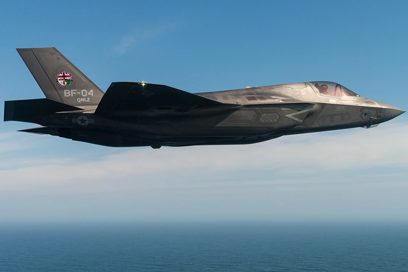 F-35B Fighter Jets Make Maiden Landings Onboard HMS Queen Elizabeth
PORTSMOUTH, ENGLAND - SEPTEMBER 26: In this handout image provided by the Ministry of Defence, An F-35B fighter jet flies over HMS Queen Elizabeth on September 26, 2018 in Portsmouth, England. Two F-35B Lightning II fighter jets have successfully landed onboard HMS Queen Elizabeth for the first time, laying the foundations for the next 50 years of fixed wing aviation in support of the UKs Carrier Strike Capability. Royal Navy Commander, Nathan Gray, 41, made history by being the first to land on, carefully manoeuvring his stealth jet onto the thermal coated deck. He was followed by Squadron Leader Andy Edgell, RAF, both of whom are test pilots, operating with the Integrated Test Force (ITF) based at Naval Air Station Patuxent River, Maryland. Shortly afterwards, once a deck inspection has been conducted and the all-clear given, Cdr Gray became the first pilot to take off using the ships ski-ramp. (Photo by Lockheed Martin/Ministry of Defence via Getty Images)