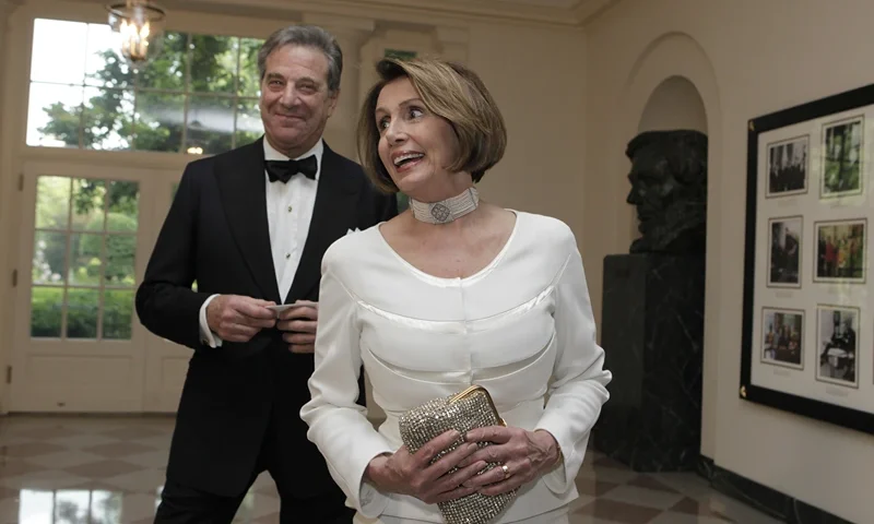 House Minority Leader Nancy Pelosi, with her husband Paul, arrives at a State Dinner for German Chancellor Angela Merkel at the White House in Washington, DC on June 7, 2011. AFP PHOTO/YURI GRIPAS (Photo by Yuri GRIPAS / AFP) (Photo by YURI GRIPAS/AFP via Getty Images)