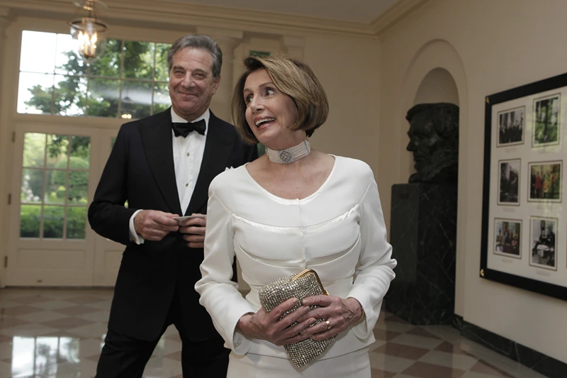 House Minority Leader Nancy Pelosi, with her husband Paul, arrives at a State Dinner for German Chancellor Angela Merkel at the White House in Washington, DC on June 7, 2011. AFP PHOTO/YURI GRIPAS (Photo by Yuri GRIPAS / AFP) (Photo by YURI GRIPAS/AFP via Getty Images)
