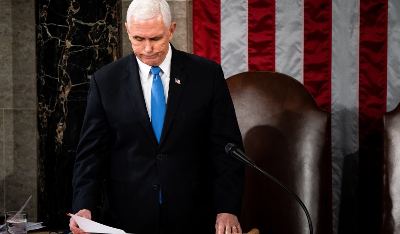 WASHINGTON, DC - JANUARY 06: U.S. Vice President Mike Pence presides over a joint session of Congress to certify the 2020 Electoral College results on January 6, 2021 in Washington, DC. Congress held a joint session today to ratify President-elect Joe Biden's 306-232 Electoral College win over President Donald Trump. A group of Republican senators said they would reject the Electoral College votes of several states unless Congress appointed a commission to audit the election results. (Photo by Erin Schaff-Pool/Getty Images)