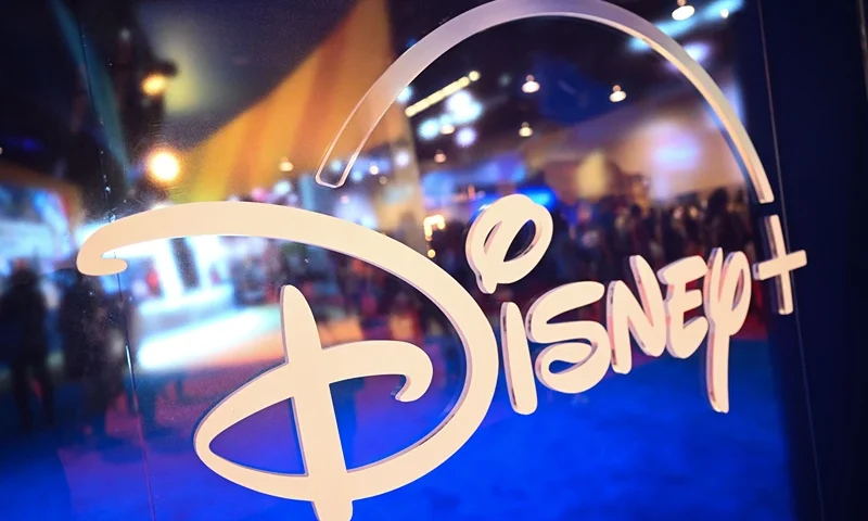 US-Entertainment-film-Disney-D23 Fans are reflected in Disney+ logo during the Walt Disney D23 Expo in Anaheim, California on September 9, 2022. (Photo by Patrick T. FALLON / AFP) (Photo by PATRICK T. FALLON/AFP via Getty Images)