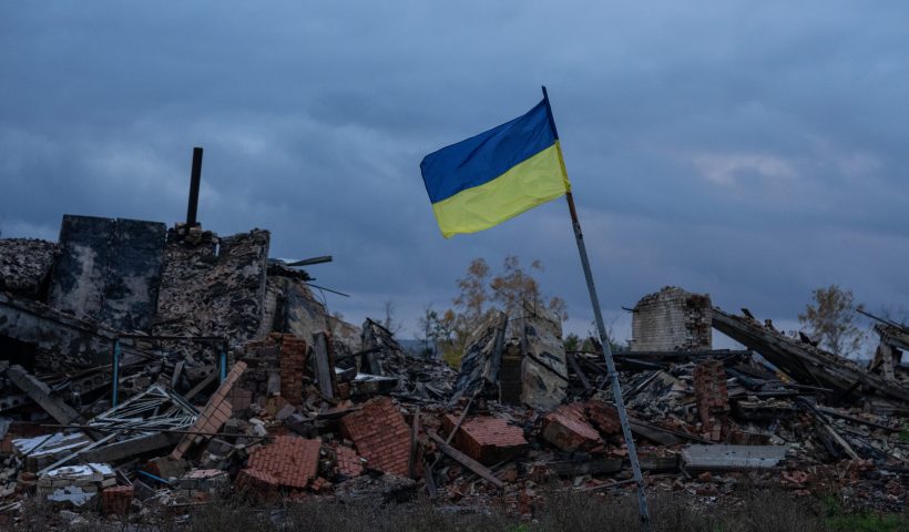 KAM'YANKA, UKRAINE - OCTOBER 24: A Ukrainian flag flies above the ruins of buildings destroyed during fighting between Ukrainian and Russian occupying forces, on October 24, 2022 in Kam'yanka, Kharkiv oblast, Ukraine. Ukraine's intelligence chief has said that Russia is sending more troops into the city of Kherson and may be preparing to defend it against a Ukrainian counteroffensive, despite previously saying that Russian forces were leaving the city. (Photo by Carl Court/Getty Images)