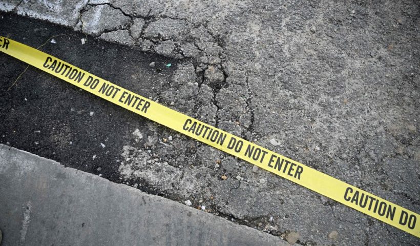 TOPSHOT - Police tape is seen on the ground at the scene of a mass shooting in Monterey Park, California, on January 22, 2023. - Ten people have died and at least 10 others have been wounded in a mass shooting in a largely Asian city in southern California, police said, with the suspect still at large hours later. (Photo by Robyn BECK / AFP) (Photo by ROBYN BECK/AFP via Getty Images)