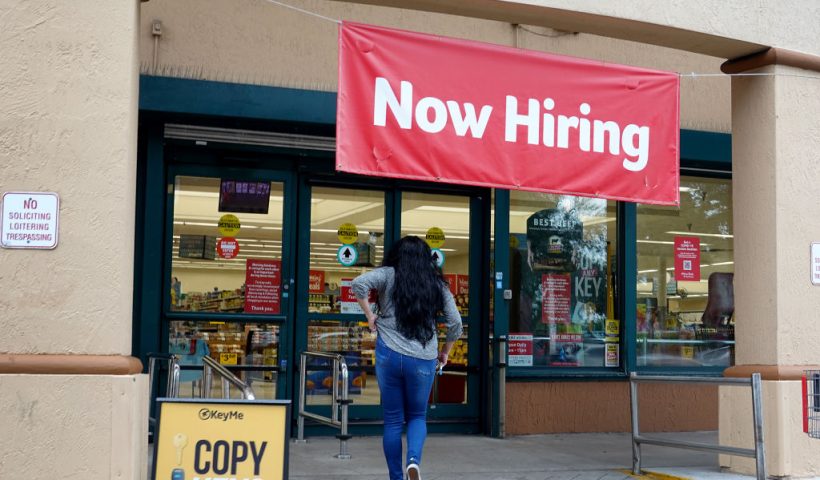 HALLANDALE, FLORIDA - SEPTEMBER 21: A Now Hiring sign hangs near the entrance to a Winn-Dixie Supermarket on September 21, 2021 in Hallandale, Florida. Government reports indicate that Initial jobless benefit claims rose 20,000 to 332,000 in the week ended Sept. 11. (Photo by Joe Raedle/Getty Images)