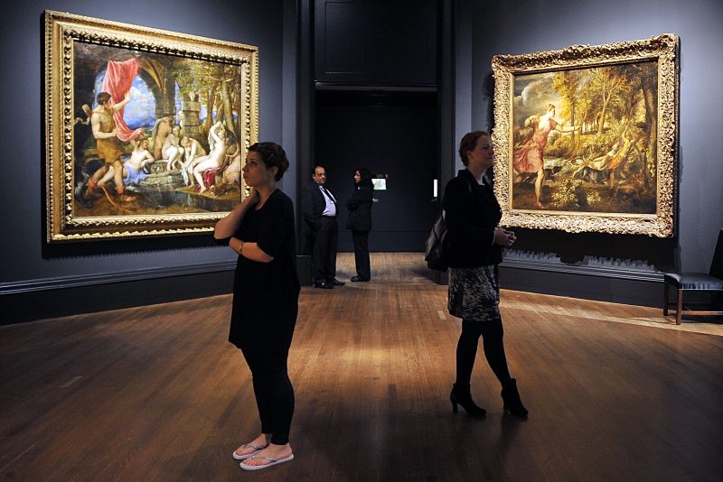 LONDON, ENGLAND - JULY 09:  People admire Titian masterpieces in the 'Metamorphosis: Titian 2012' Exhibition at the National Gallery on July 9, 2012 in London, England. The 'Metamorphosis: Titian 2012' Exhibition, which includes work by contemporary artists inspired by the Titian masterpieces, will run from July 11, 2012 until September 23, 2012.  (Photo by Bethany Clarke/Getty Images)