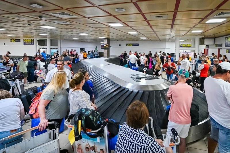 Passengers wait for their luggage at Havana's Jose Marti airport on October 12, 2023. (Photo by ADALBERTO ROQUE / AFP) (Photo by ADALBERTO ROQUE/AFP via Getty Images)