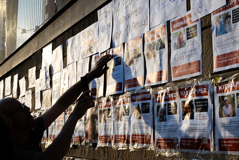 Montreal suburb to enforce ,000 penalty for removing Gaza hostage posters.