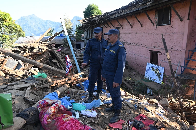 NEPAL-EARTHQUAKE
Nepali policemen inspect the rubble of houses in Jajarkot district on November 4, 2023, following an overnight a 5.6-magnitude earthquake. At least 132 people were killed in an overnight earthquake of 5.6-magnitude that struck a remote pocket of Nepal, officials said on November 4, as security forces rushed to assist with rescue efforts. (Photo by PRAKASH MATHEMA / AFP) (Photo by PRAKASH MATHEMA/AFP via Getty Images)