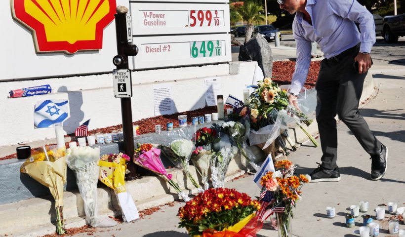 THOUSAND OAKS, CALIFORNIA - NOVEMBER 07: A person places flowers at a makeshift memorial at the site of an altercation between 69-year-old Paul Kessler, who was Jewish, and pro-Palestinian protestor on November 7, 2023 in Thousand Oaks, California. Kessler died of a head injury he sustained from falling during the confrontation at dueling Israeli and Palestinian protests on November 5. The death was ruled a homicide by the Ventura County Medical Examiner’s Office. (Photo by Mario Tama/Getty Images)