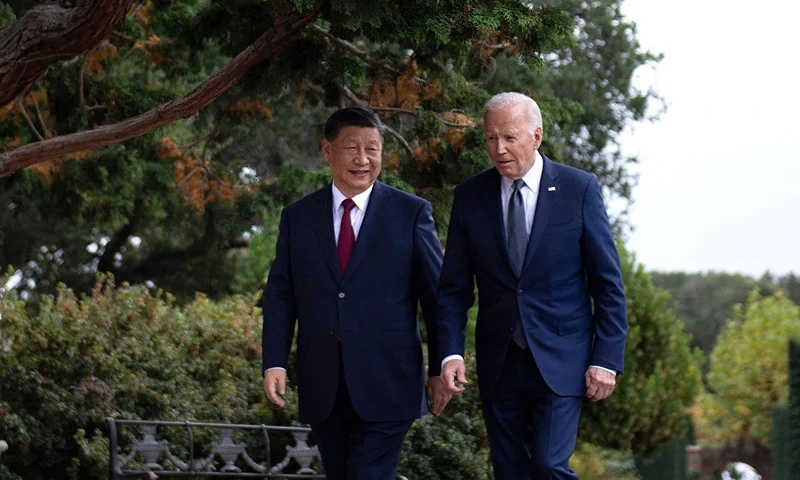 US President Joe Biden (R) and Chinese President Xi Jinping walk together after a meeting during the Asia-Pacific Economic Cooperation (APEC) Leaders' week in Woodside, California on November 15, 2023. Biden and Xi will try to prevent the superpowers' rivalry spilling into conflict when they meet for the first time in a year at a high-stakes summit in San Francisco on Wednesday. With tensions soaring over issues including Taiwan, sanctions and trade, the leaders of the world's largest economies are expected to hold at least three hours of talks at the Filoli country estate on the city's outskirts. (Photo by Brendan Smialowski / AFP) (Photo by BRENDAN SMIALOWSKI/AFP via Getty Images)
