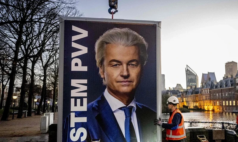 Workers prepare to remove an election sign of Party for Freedom (PVV) leader Geert Wilders near the Binnenhof, a day after the Netherlands general elections, in the Hague on November 23, 2023. Far-right firebrand Geert Wilders faced an uphill struggle to woo rivals for a coalition government after a "monster victory" in Dutch elections that shook the Netherlands and Europe. (Photo by Robin Utrecht / ANP / AFP) / Netherlands OUT (Photo by ROBIN UTRECHT/ANP/AFP via Getty Images)