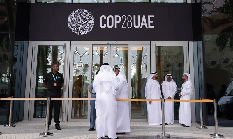 DUBAI, UNITED ARAB EMIRATES - NOVEMBER 29: Men wearing thawbs stand outside a venue at the UNFCCC COP28 Climate Conference the day before its official opening on November 29, 2023 in Dubai, United Arab Emirates. The COP28 is bringing together stakeholders, including international heads of state and other leaders, scientists, environmentalists, indigenous peoples representatives, activists and others to discuss and agree on the implementation of global measures towards mitigating the effects of climate change. (Photo by Sean Gallup/Getty Images)