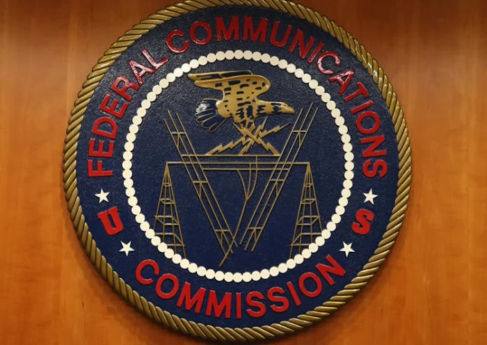 WASHINGTON, DC - FEBRUARY 26: The seal of the Federal Communications Commission hangs inside the hearing room at the FCC headquarters February 26, 2015 in Washington, DC. The Commission will vote on Internet rules, grounded in multiple sources of the Commissions legal authority, to ensure that Americans reap the benefits of an open Internet. (Photo by Mark Wilson/Getty Images)
